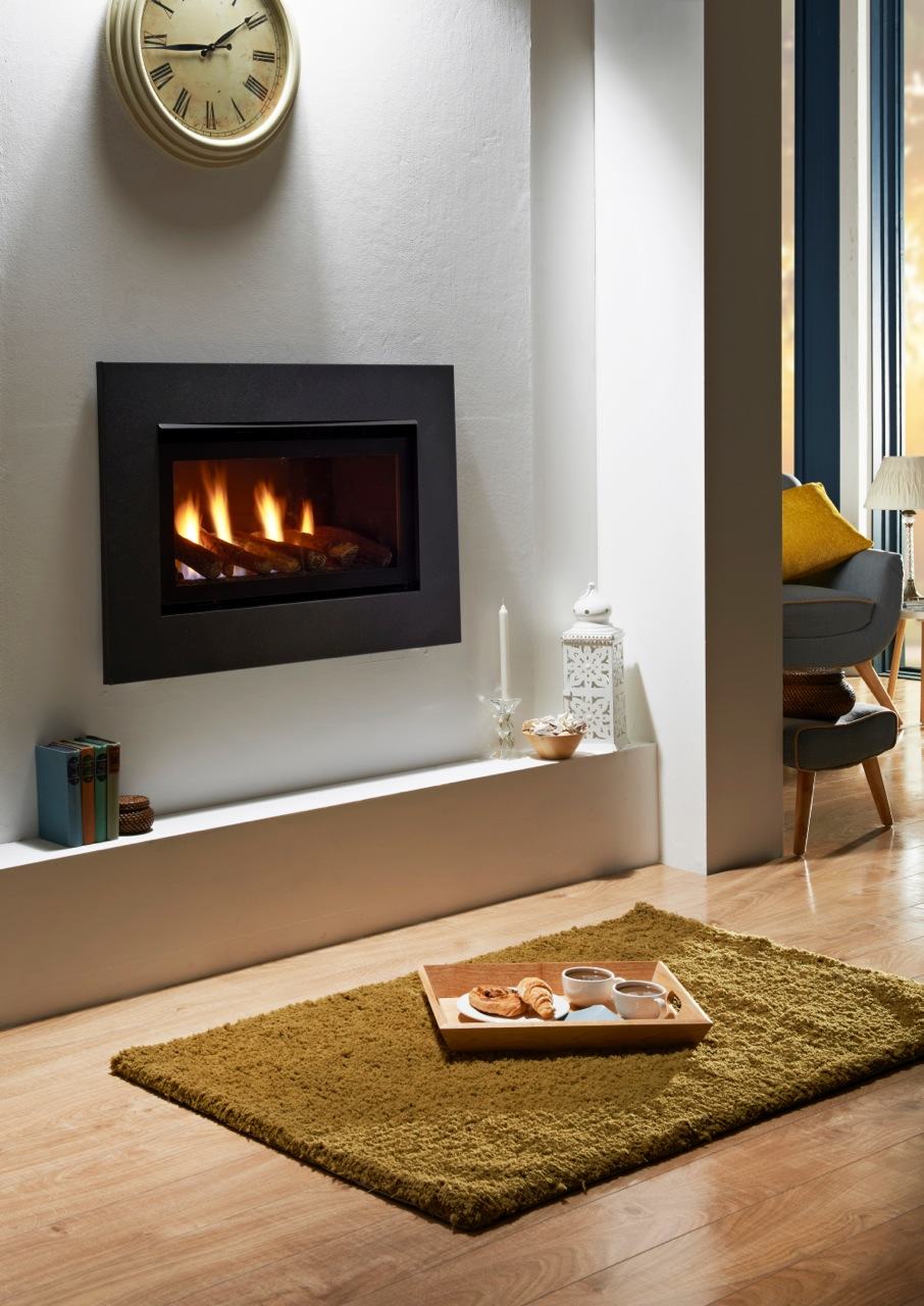 Luxurious living room with modern inset gas fireplace glowing